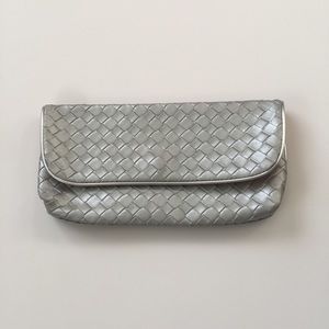 Cute silver woven leather like clutch coral inside